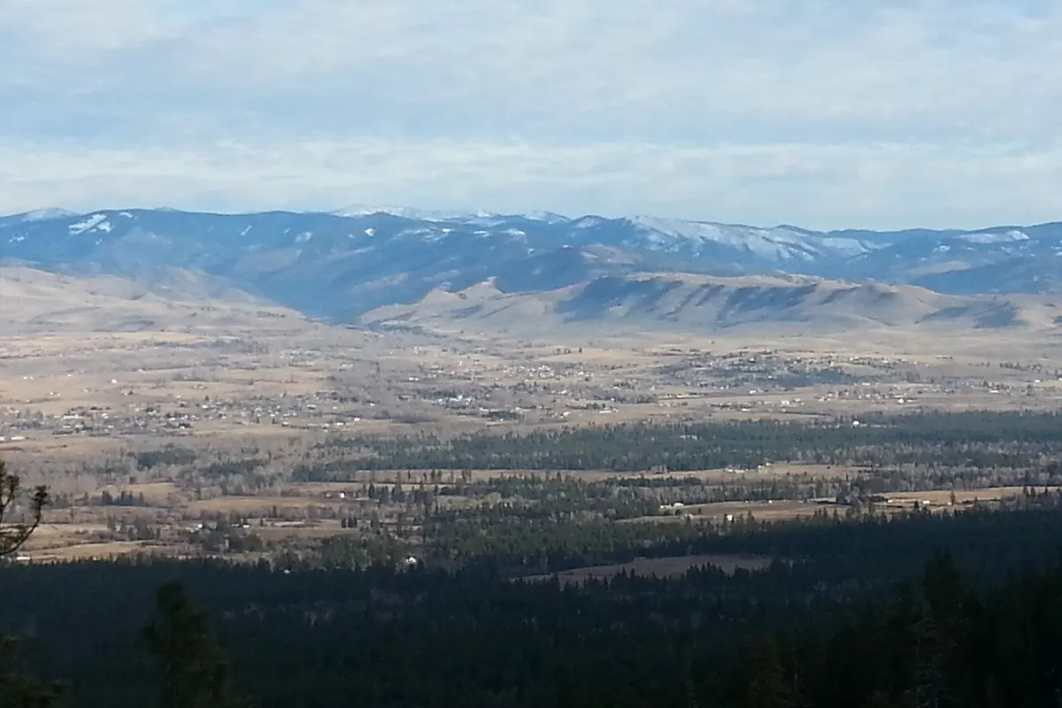 Hamilton, Montana on the valley floor with the Sapphire Mountains stretching across the horizon.